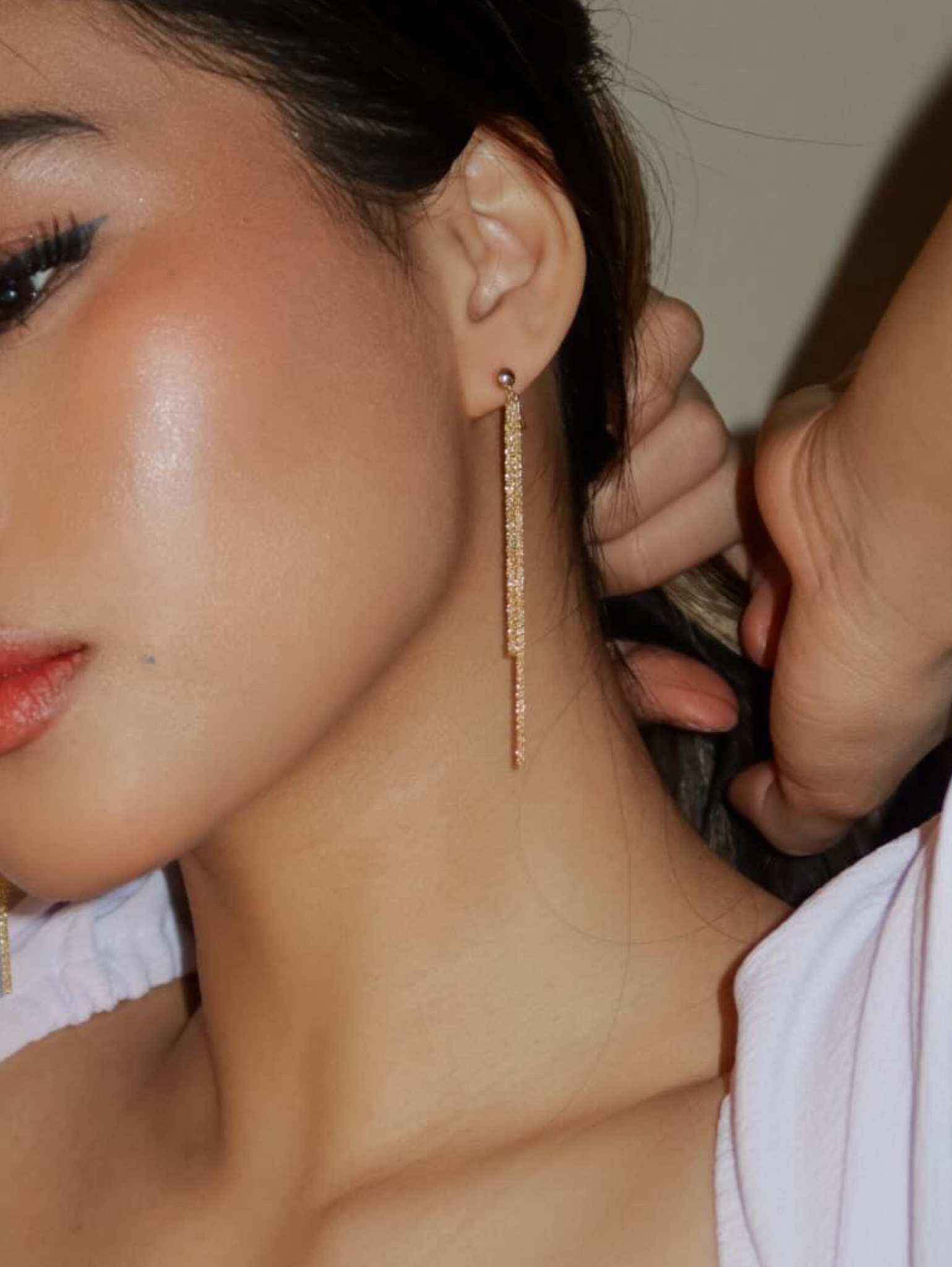 long double gold chain clipon earrings on model