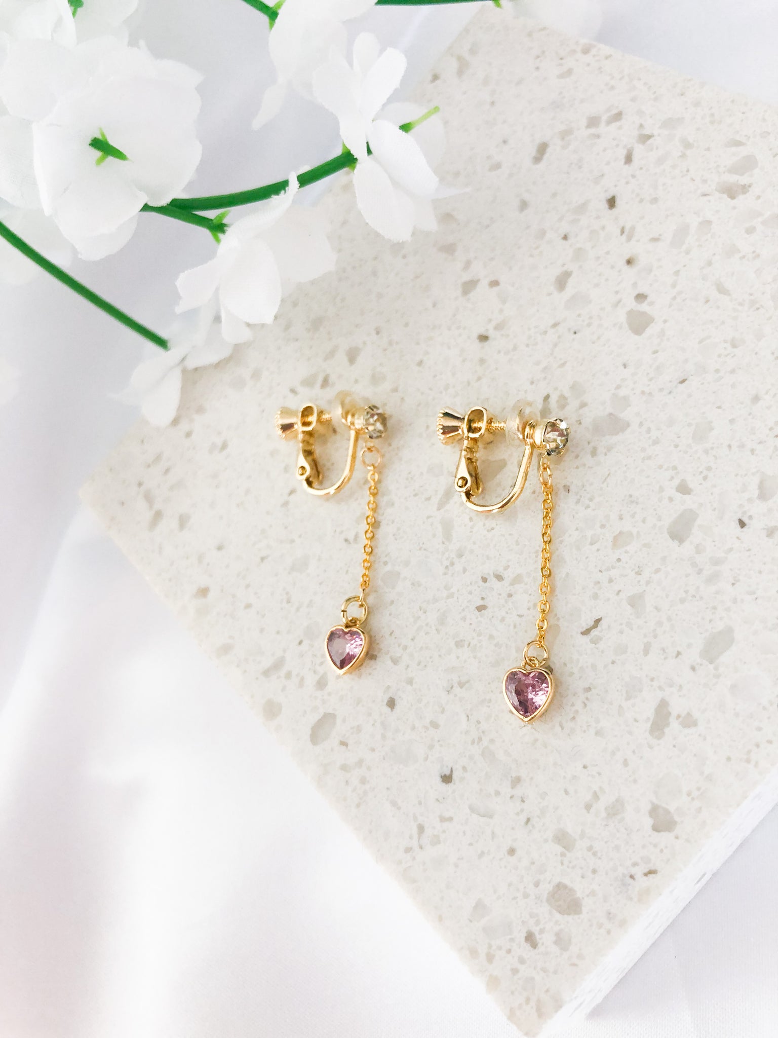 gold dangle screwback clip-on earrings with pink heart charm