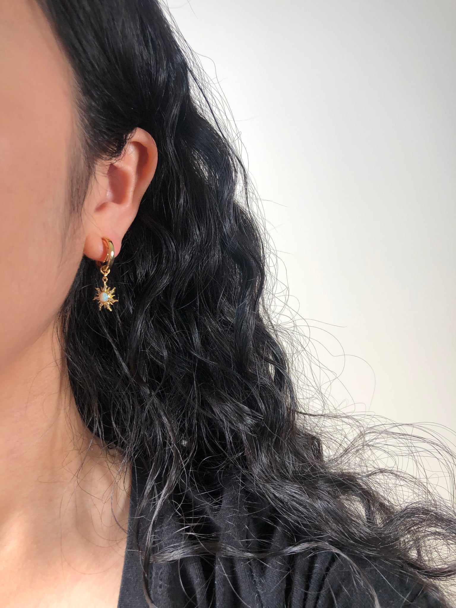 gold clipon hoop earrings with constellation sun charm