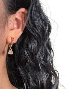 small gold clip-on hoop earrings with pink triangle charm