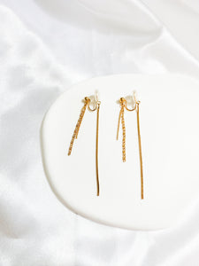 A pair of gold-colored threader dangle earrings