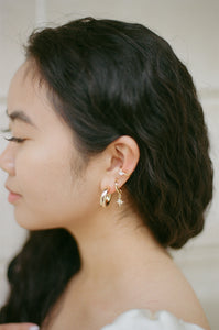 gold clipon hoop earrings with star constellation charm