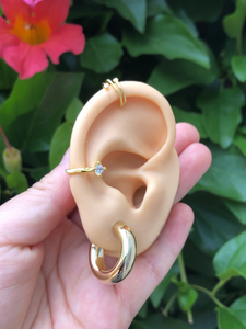gold ear stack with ear cuffs and gold hoop earrings