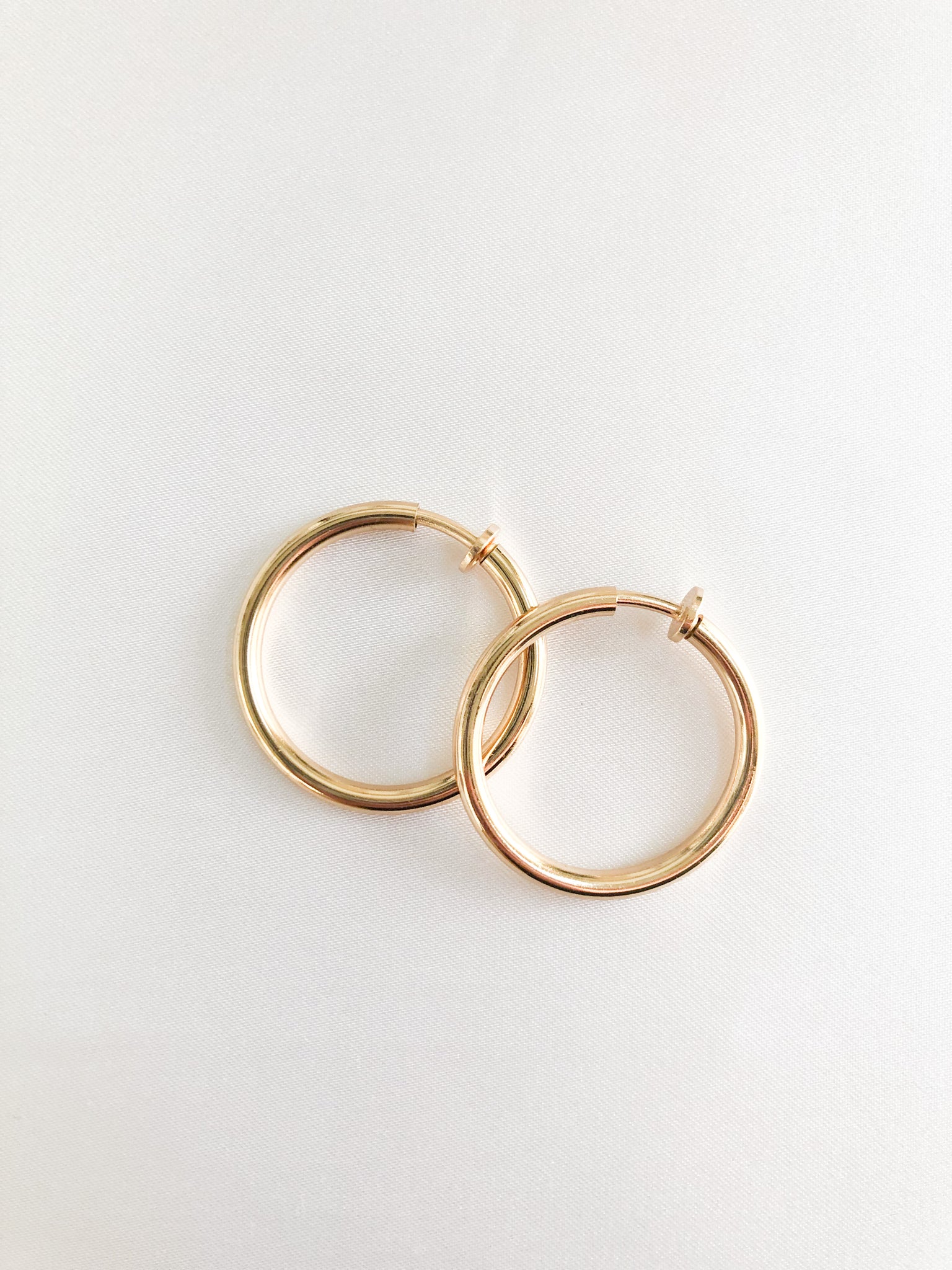 gold 1.25 width clip on hoops