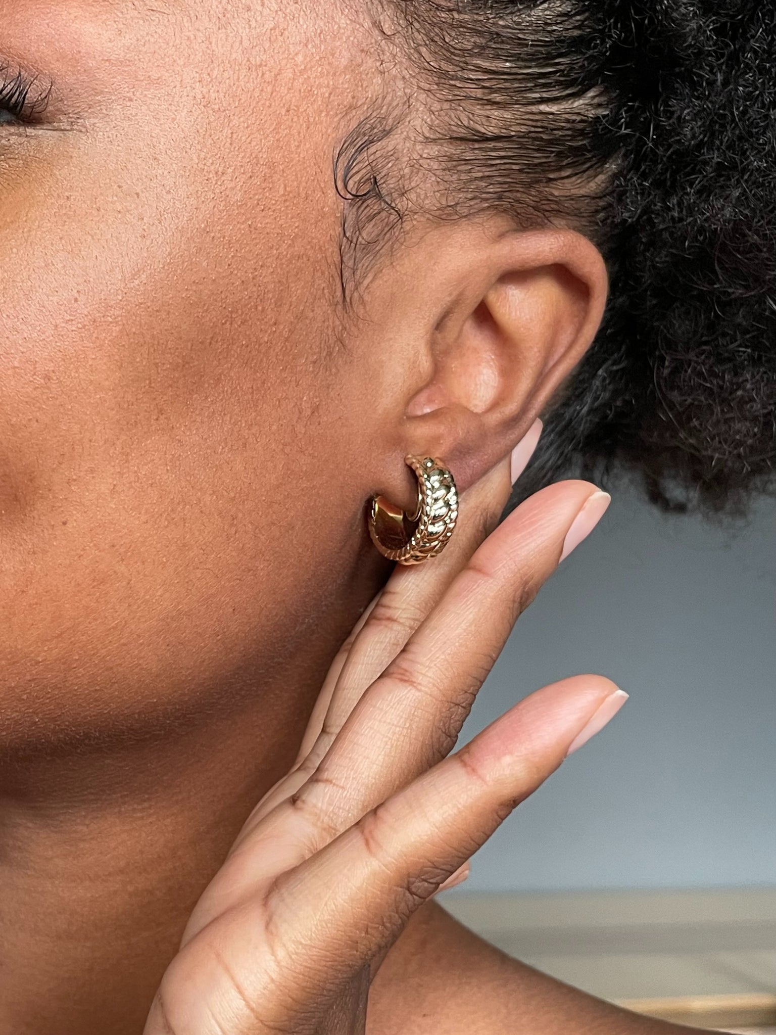 chunky gold braided clip on hoop earrings on model