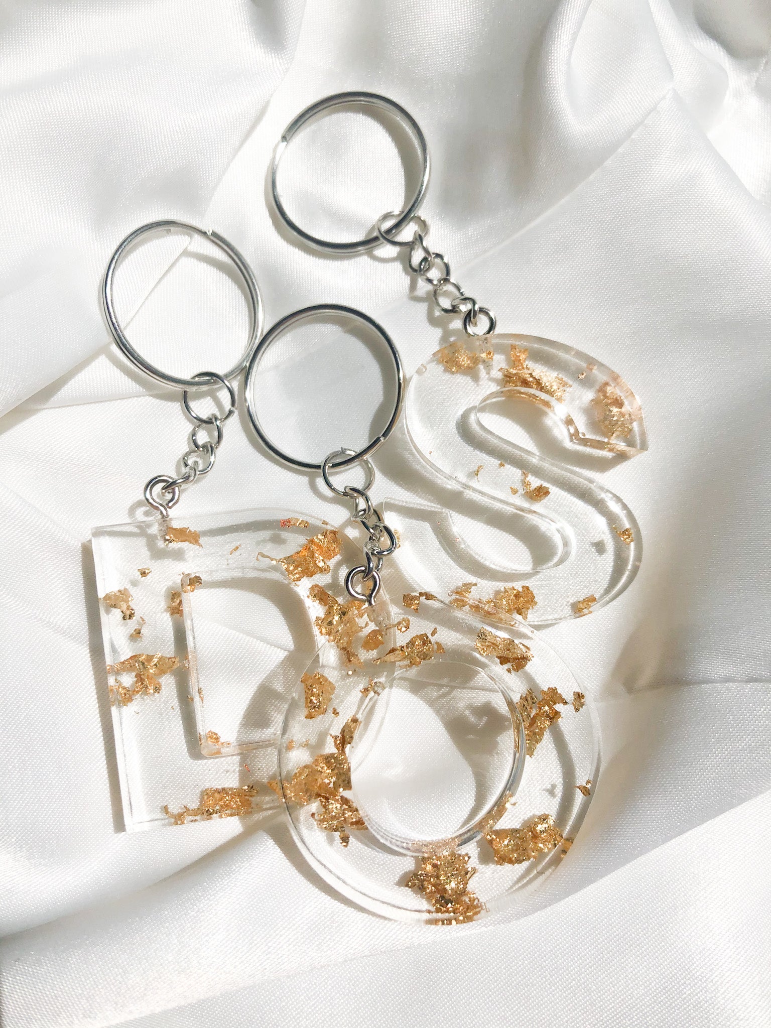 clear resin letter keychains with gold foil inside and silver chain